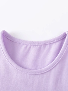 Close-up of lilac cotton knit crew neck collar with smooth ribbed edging on girls dress