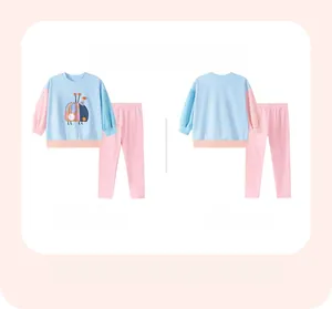 Detail view of girls long-sleeve cotton set with cartoon ladybug and pink pants
