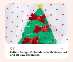 Détail de broderie sapin de Noël avec nœuds en satin rouge sur tissu à pois
