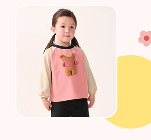 Detail of toddler sweatshirt with 3D bear applique and contrast patchwork sleeves