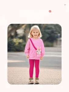 Detail of girls pink sweatshirt with cute rabbit bag design and matching leggings