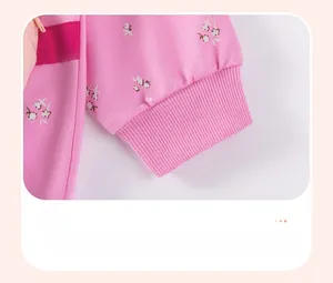 Detail of pink floral toddler top featuring elastic ribbed cuffs and soft cotton fabric