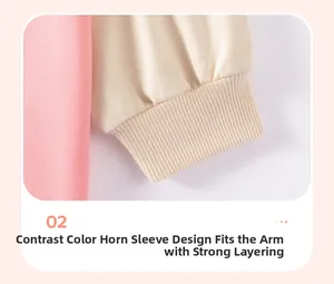 Detail of contrast raglan sleeve with elastic ribbed cuff on pink girls' cotton top