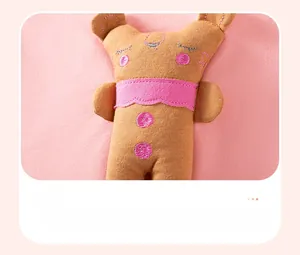 Detailed close-up of a 3D plush bunny embroidery on soft pink knitted toddler fabric