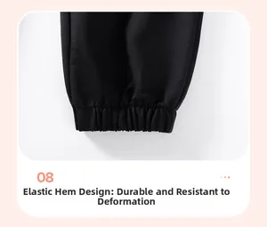 Détail des poignets élastiques en maille sur un pantalon noir pour garçon durable