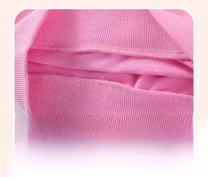 Close-up of double-stitched cuffs on pink cotton long-sleeve knitwear for girls