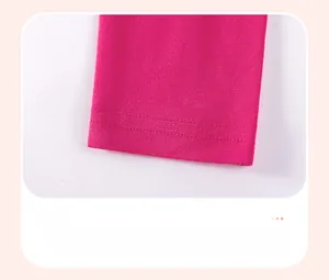 Detail showing the double-stitched hem on soft rose red cotton toddler trousers