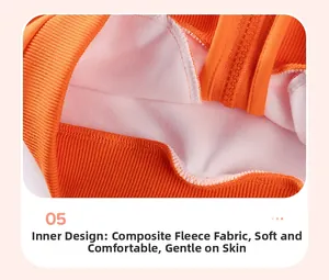 Detail of orange ribbed cuffs and warm white composite fleece lining on a boys' jacket