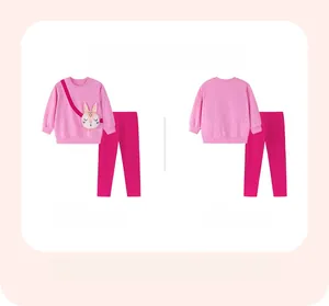 Detailed flat lay of pink girls long-sleeve cotton set with floral pattern and rabbit embroidery