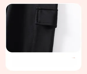 Detail of the black cargo pocket with neat stitching on fleece-lined boys' trousers