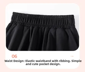Detail of children's cotton pants featuring an elastic waistband and functional side pockets