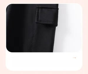 Close-up of black cargo pants featuring a side flap pocket with precise stitching