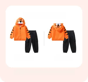 Front and back view of boys orange tiger hoodie and black cargo pants set