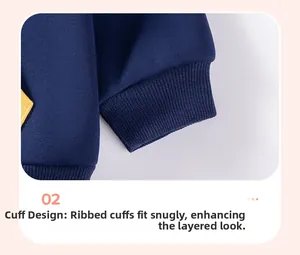 Detail of ribbed cuffs on navy blue kids' hoodie with yellow diamond patch accent