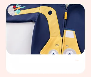 Detail of navy boy's hoodie showing a yellow excavator embroidery with veggie motifs