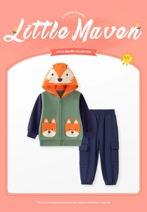 Detail view of cotton hoodie with fox hood and navy trousers for toddler boys