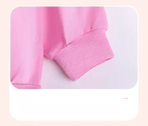 Close-up of pink cotton sweatshirt featuring elastic ribbed cuffs for children