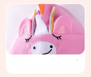 Detailed embroidery of a sleeping unicorn and 3D ears on a pink cotton girl's hoodie