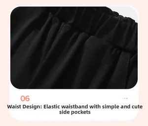 Close-up of elastic waistband and side pocket detail on girls black cotton sweater