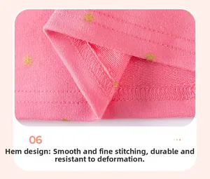 Close-up detail of double-stitched hem on pink star print dress for little girls