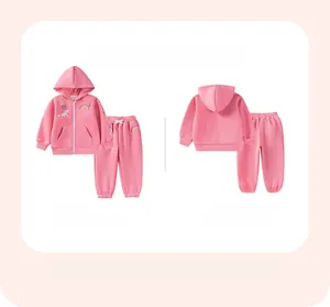 Detail of pink fleece toddler tracksuit with unicorn and rainbow prints for autumn