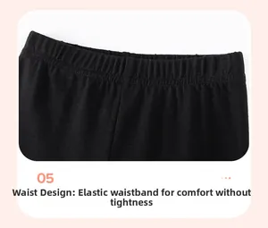 Detail of the high-elastic waistband on black cotton pants for girls with smooth stitching