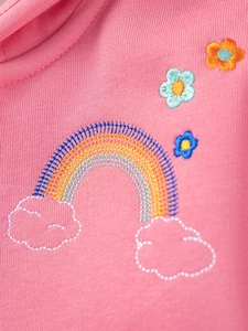 Pink knitted girls' outfit featuring detailed rainbow and clouds embroidery decorations