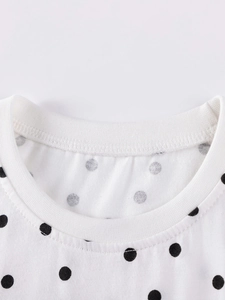 Classic white cotton long-sleeve kids T-shirt featuring a black polka dot pattern and round neck