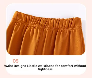 Détail de la taille élastique d'un pantalon pour enfant jaune gingembre au tissu doux