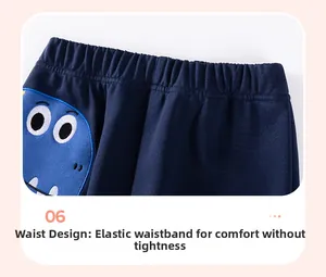 Détail du pantalon bleu foncé pour garçon avec taille élastique et imprimé dinosaure