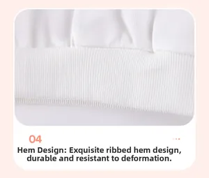 Close-up of white rib-knit hem detailing on a girl's long-sleeve cotton outfit