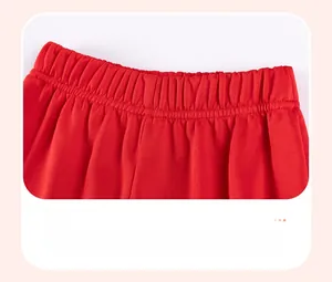 Detail view of the red knitted cotton toddler set showing the elastic waistband design