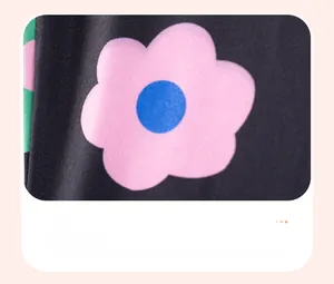 Detail of pink floral knit fabric print on dark toddler clothing material