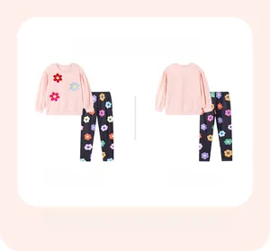 Detailed front and back view of girls pink long sleeve top with floral applique and pants