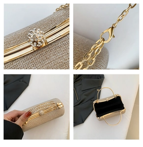 Detail of glitter gold evening clutch showing rhinestone sphere clasp and metal chain strap