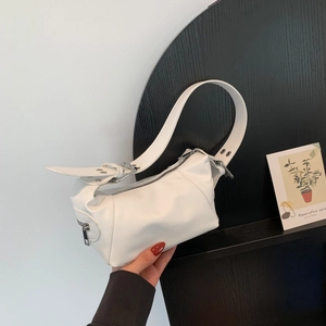 Minimalist white leather underarm bag with adjustable strap and metal zipper