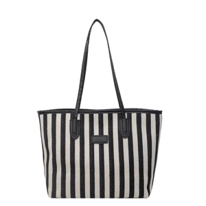 Grote gestreepte canvas tote bag met zwart kunstlederen handvatten en centrale patch