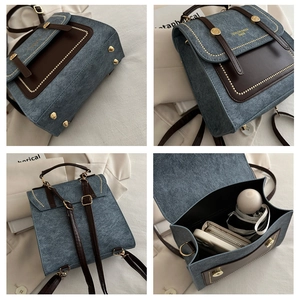 Detail van retro denim rugzak met bruine lederen flap en een ruime binnenkant voor opslag