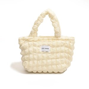 Beige cloud bubble textured tote bag featuring a white LOVE FASHION decorative label