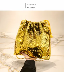 Close-up of golden sequin tote bag with drawstring closure and luxury chain strap