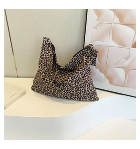 Close-up of leopard print canvas tote bag showing durable fabric texture and large capacity