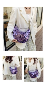 Detail of purple sequin crescent shoulder bag with silver chain strap on a model