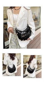 Macro detail of fashionable black sequined crescent bag with silver chain strap