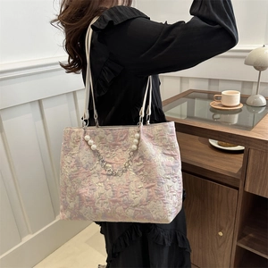 Pink and gold jacquard tote bag with pearl heart chain strap and embroidery detail