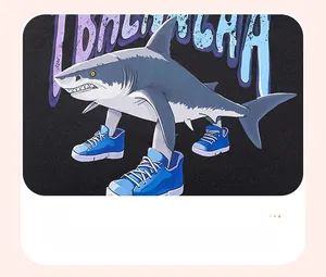 Detailed view of shark heat transfer print on dark cotton fleece sweatshirt for boys