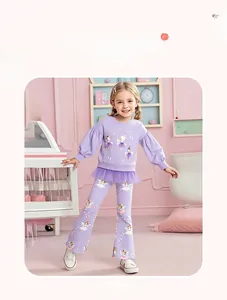 Detail of girl's purple sweatshirt with ballet dancer print and floral flared trousers