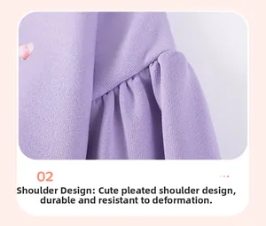 Detail of lavender knit top featuring gathered shoulder design and heart pattern