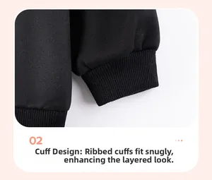 Detail of ribbed cuffs on girls Christmas sweatshirt showing elastic fit and fabric texture