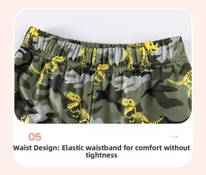 Détail du short de camouflage pour garçons avec taille élastique et motif de dinosaure