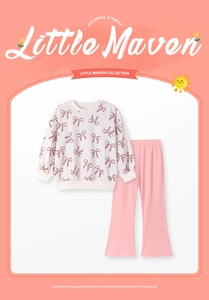 Detail of girls floral long sleeve sweatshirt and pink flared trousers outfit set